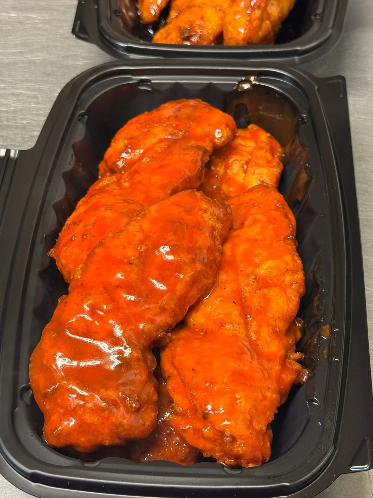 Hand-breaded chicken tenders tossed in buffalo sauce at Mo’s in Simsbury.