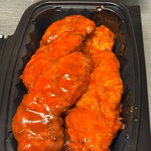 Hand-breaded chicken tenders tossed in buffalo sauce at Mo’s in Simsbury.